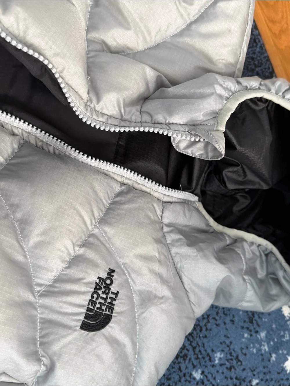 The North Face Kids Black Hooded Puffer Jacket with Light Gray Trim